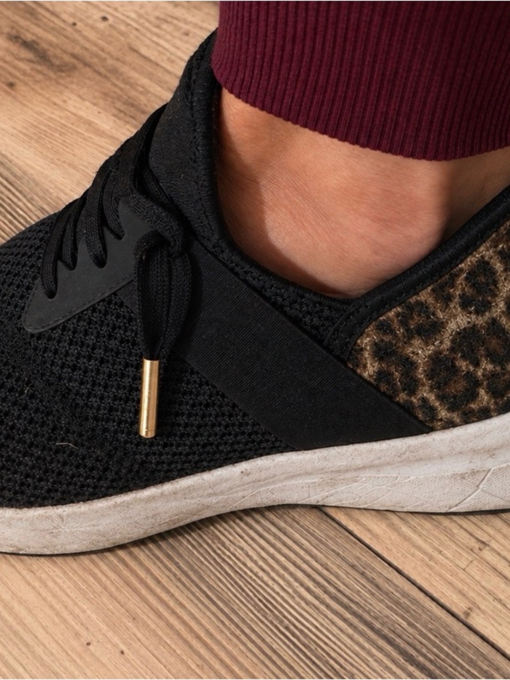 New Balance Black Knit Athletic Sneaker with Leopard Heel Accent